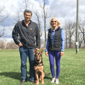 photo of Jeff and Shelley H. from Wyomissing PA. with their dog training graduate, Jax.