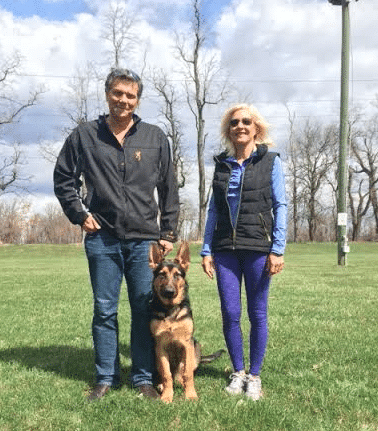 photo of Jeff and Shelley H. from Wyomissing PA. with their dog training graduate, Jax.